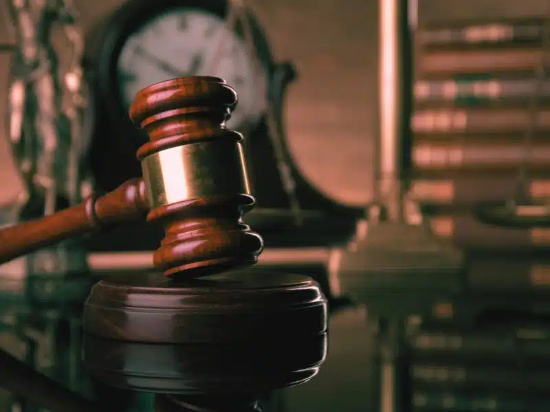 Gavel and clock on a desk - Drug Possession Lawyer in Carrollton, GA